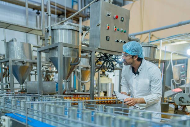 Quality and healthcare professionals supporting manufacturing